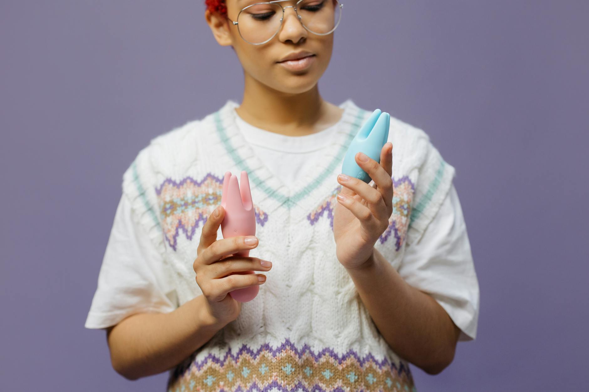 Woman holding lemon vibrators with a thoughtful expression, considering comfort and pleasure.